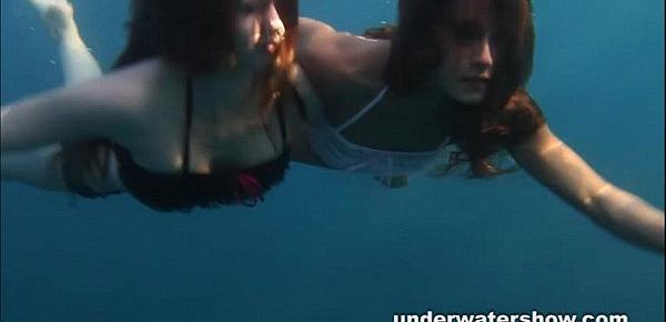  Nastya and Masha are swimming nude in the sea